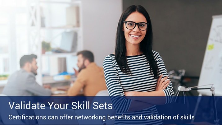 A woman with her arms crossed with two other employees in the background sitting at a table. There is a banner that says "validate your skill sets" at the bottom of the image.