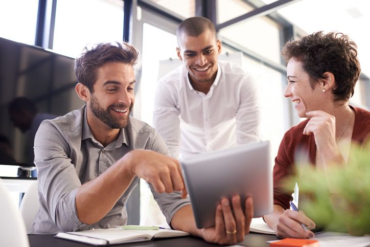 Project team works together in an office.